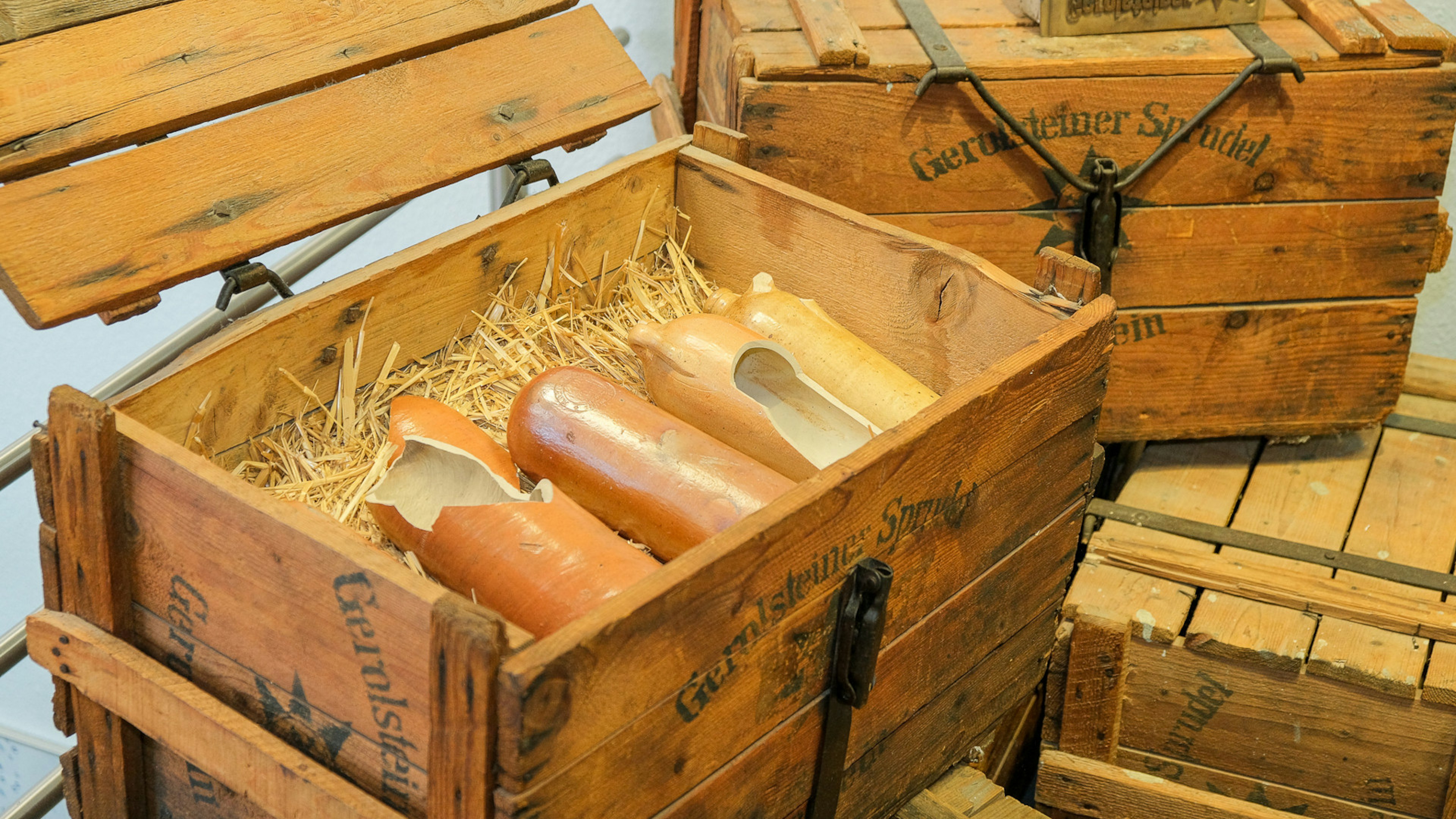 Wooden box with old Gerolsteiner clay bottles. 